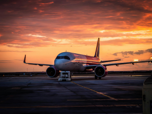 Aeroplane on runway in sunset